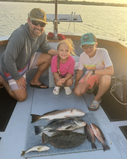 Fishing Charters 17 Family showing their catch in St. Augustine from inshore fishing charter.