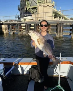 Fishing Charters 19 Fishing the bridge in St. Augustine. Large redfish catch.